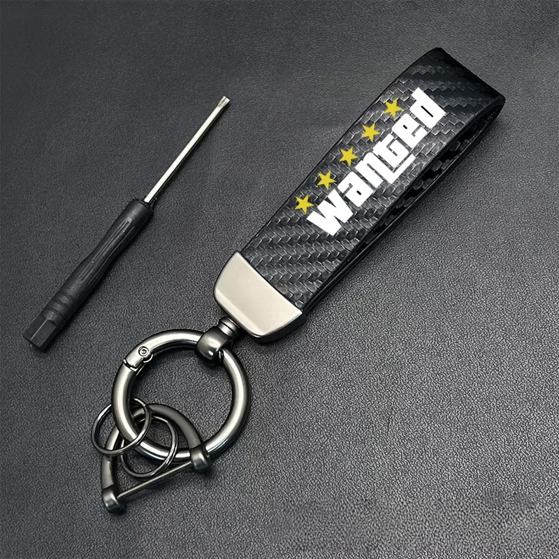 E-shop 1 Stück WANTED Text Carbonfaser Schlüsselanhänger, Carbonfaser Optik, Zinklegierung Material, Modisches Design, Herren Auto Schlüsselanhänger
