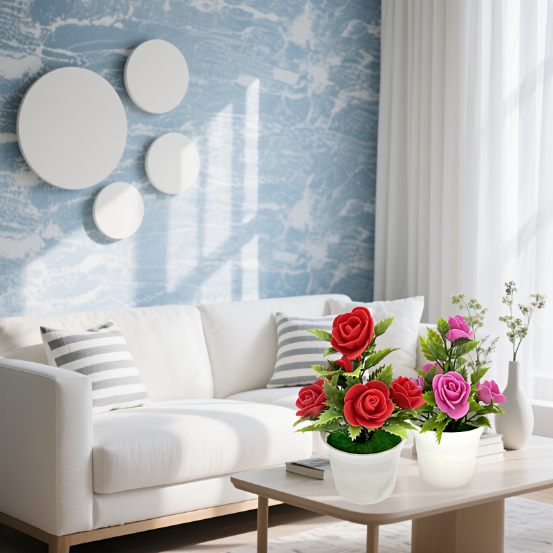 Twee levensechte kunstmatige rozen in pot