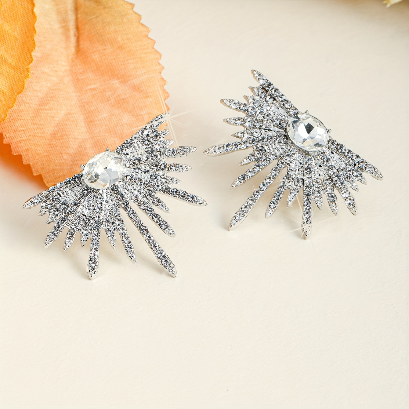 A Pair of Dazzling Wing-Shaped Earrings Adorned with Rhinestones, Perfect for Women. These Elegant And Distinctive Bridal Earrings Are Trendy, Lightweight Statement Pieces Ideal for Proms And Parties