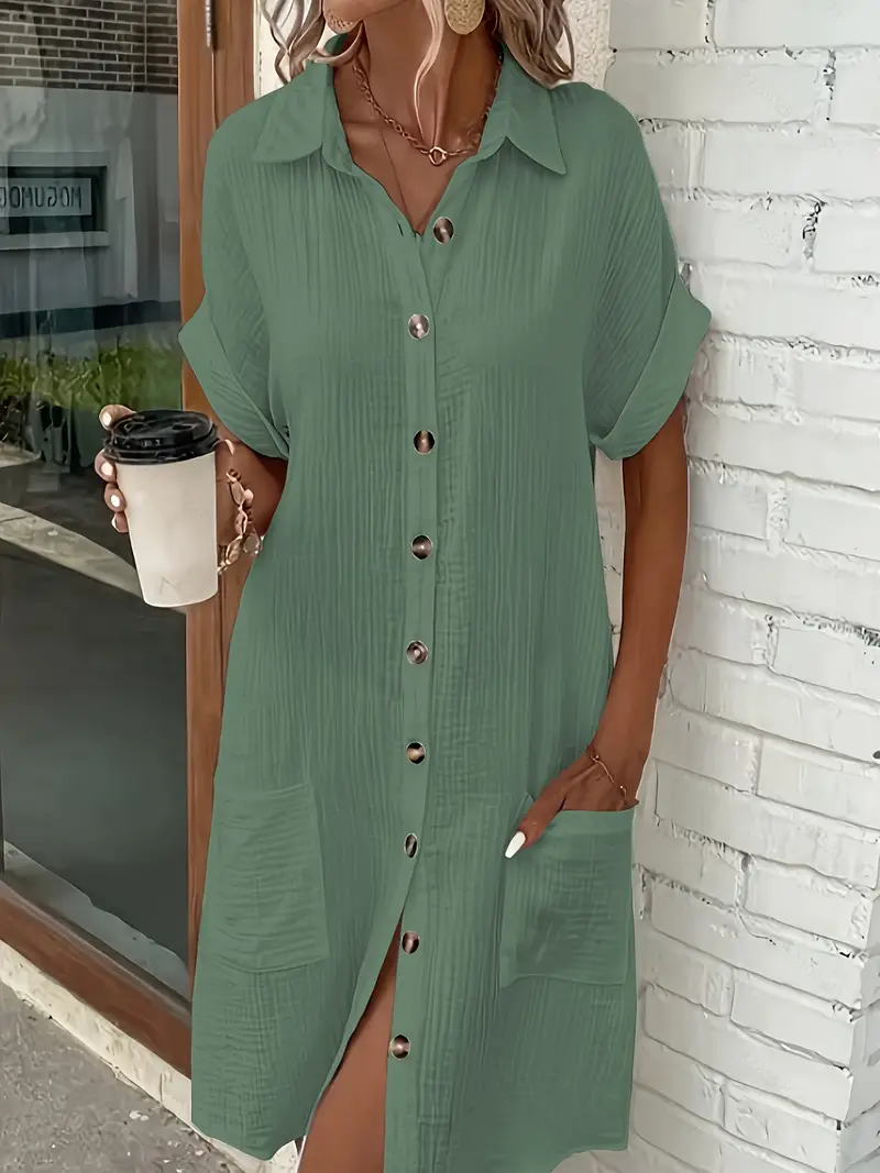 a minimalist white shirt dress made of breathable featuring a sharp collar design and buttons that add a touch of details 14