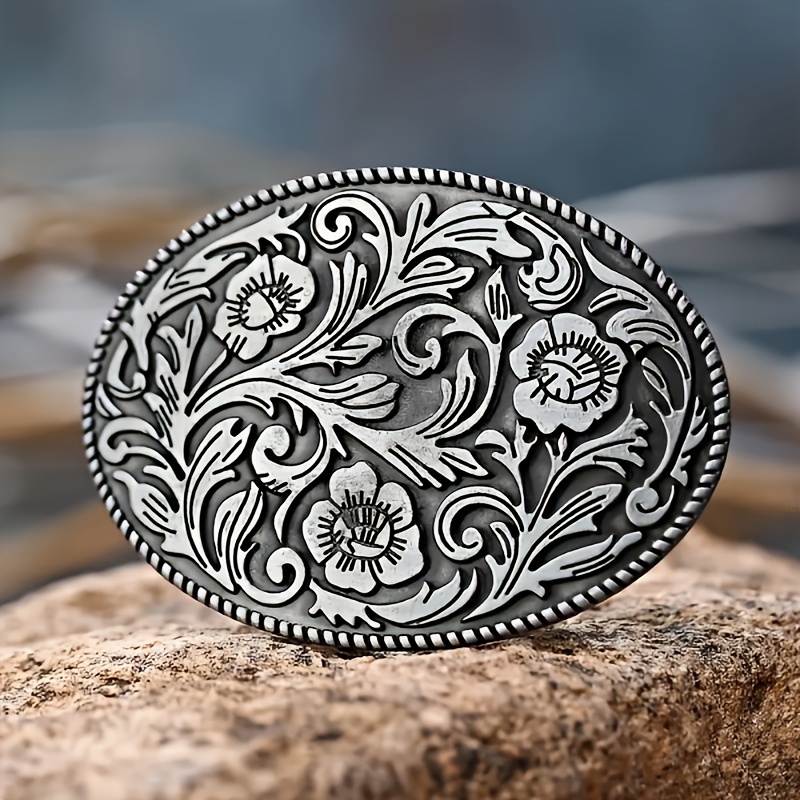 

A With An Elliptical Flower, Green Leaves, And Spiral Patterns With Styles Of Belts.