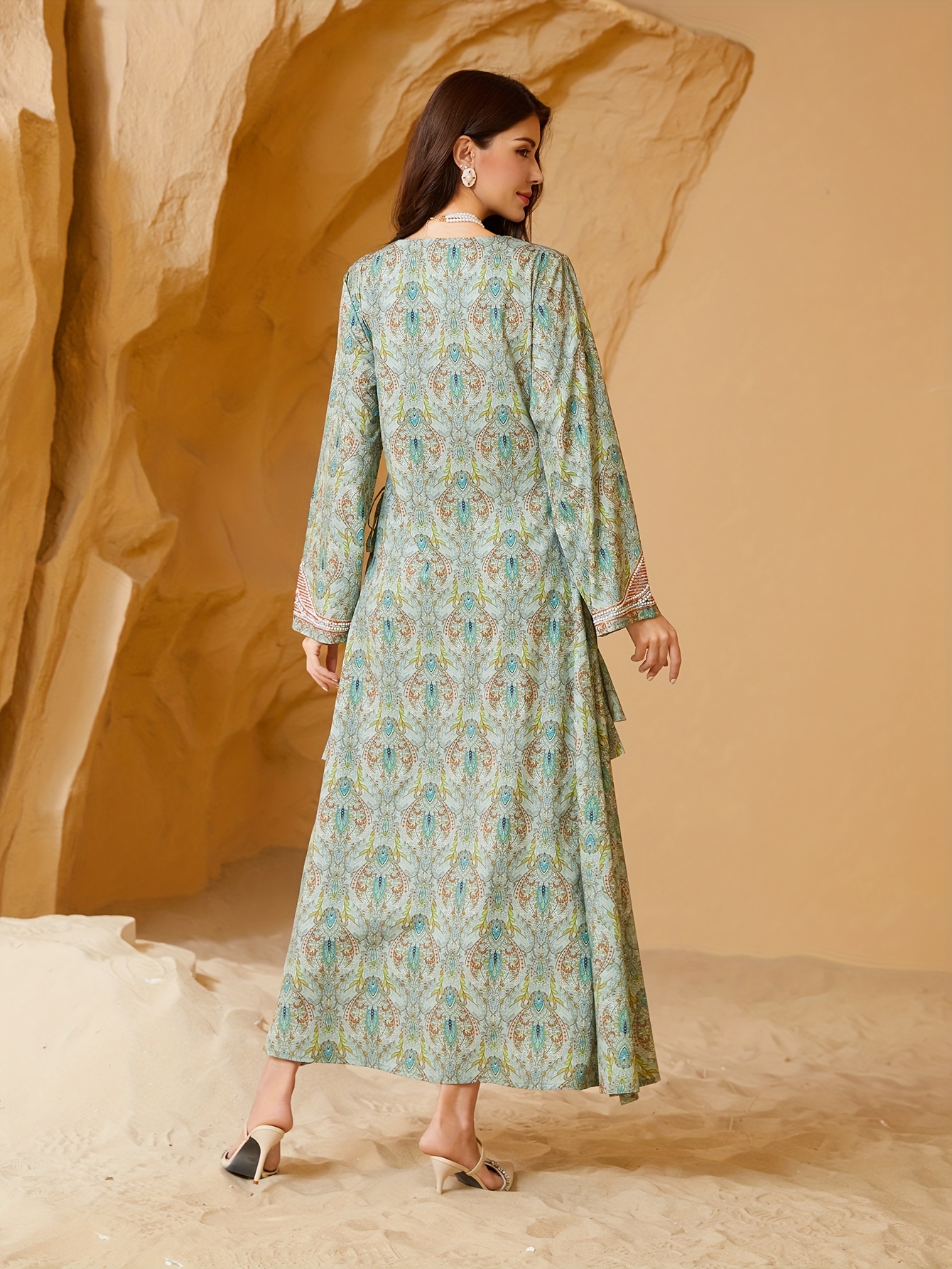 A Women'S Muslim Dress Featuring a Printed Design with Sparkling *  Embellishments, an Elegant Islamic Abaya