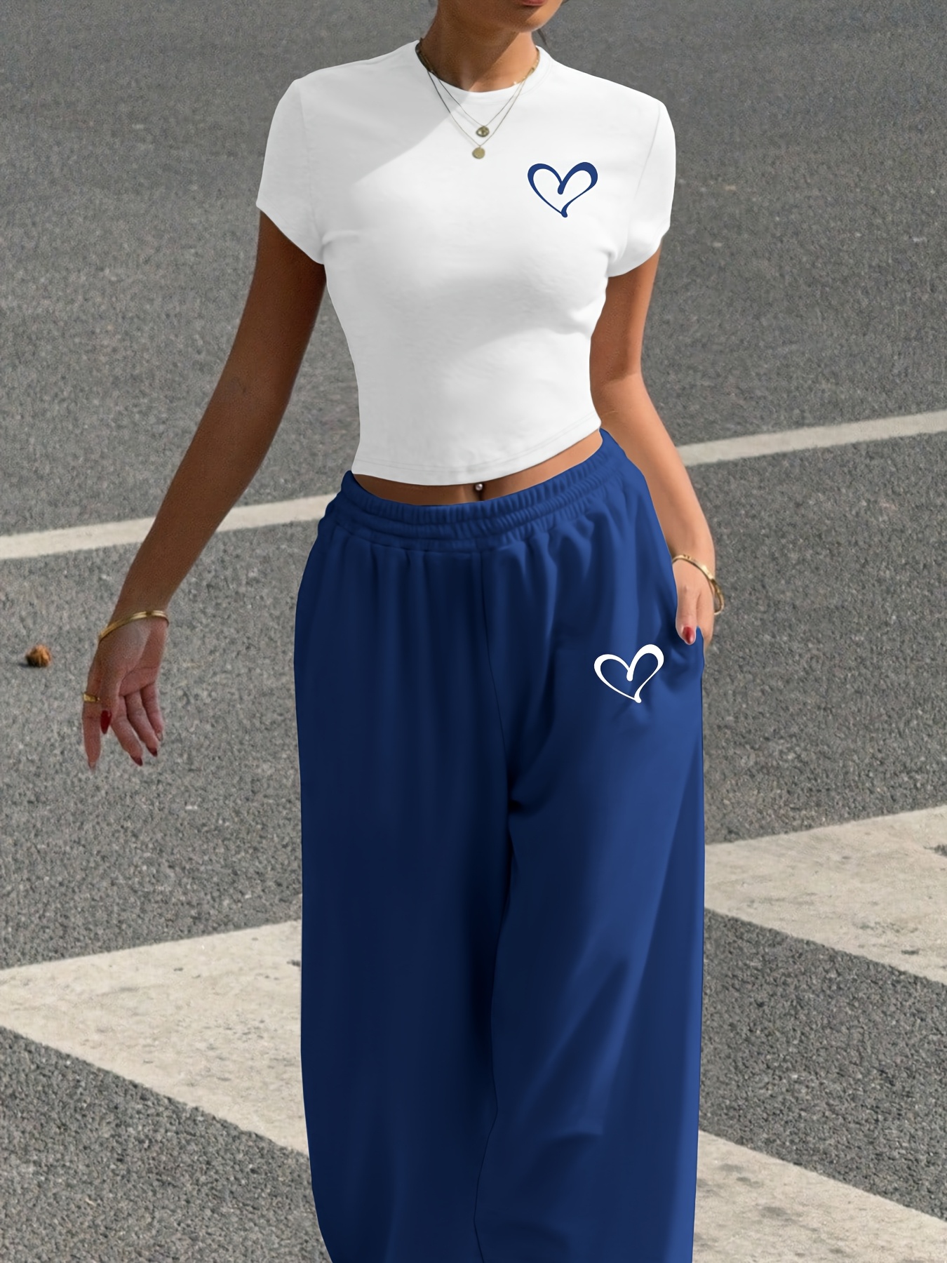 A Stylish Two-Piece Set for All Seasons, Featuring a Heart Print Casual Outfit, Consisting of a Fitted White Short T-Shirt And Tapered Jogger Pants, Machine Washable, Perfect for Street Fashion And Vibes