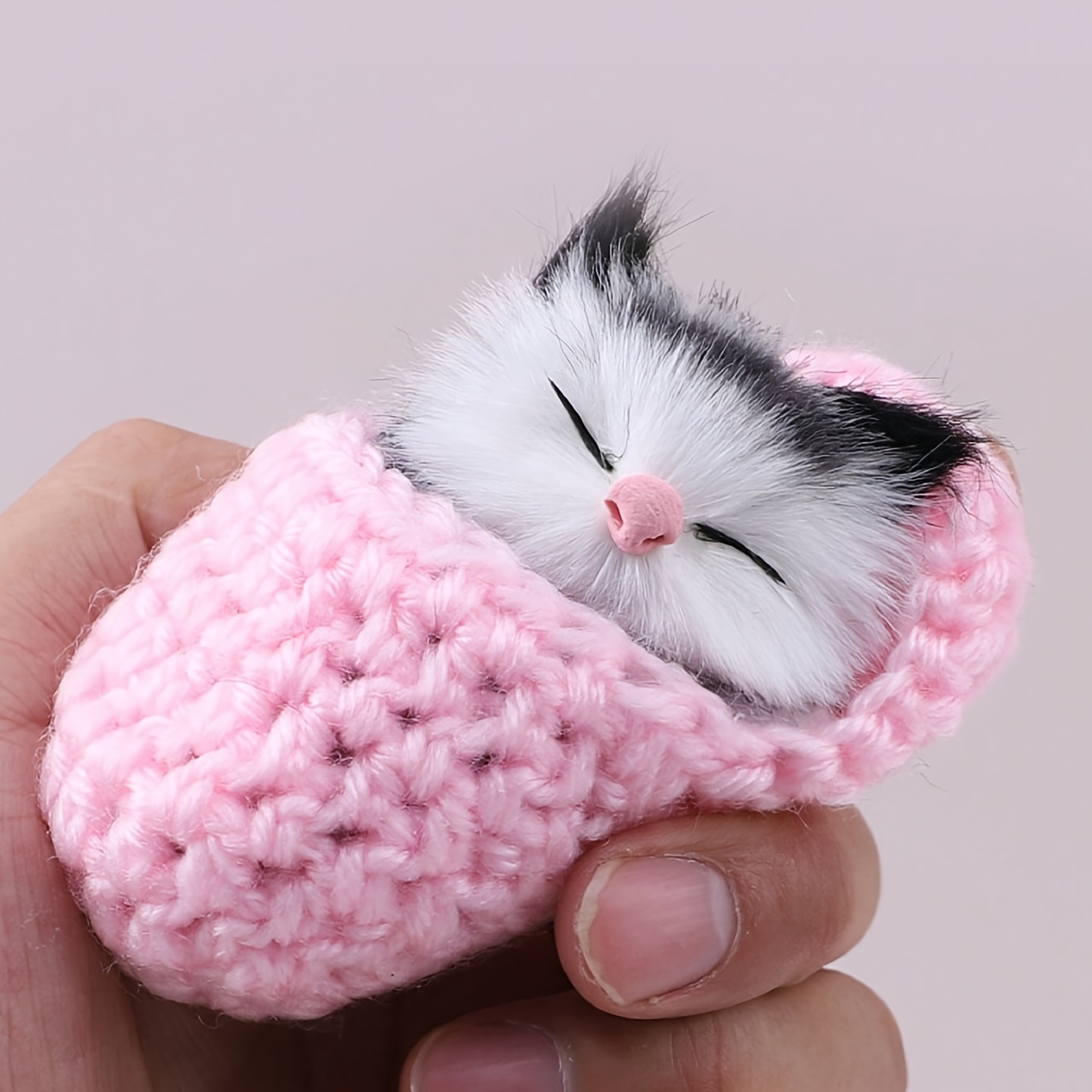 a realistic cat figurine a cute plush toy of a kitten a decorative cat piece a slipper cat and a stuffed cat