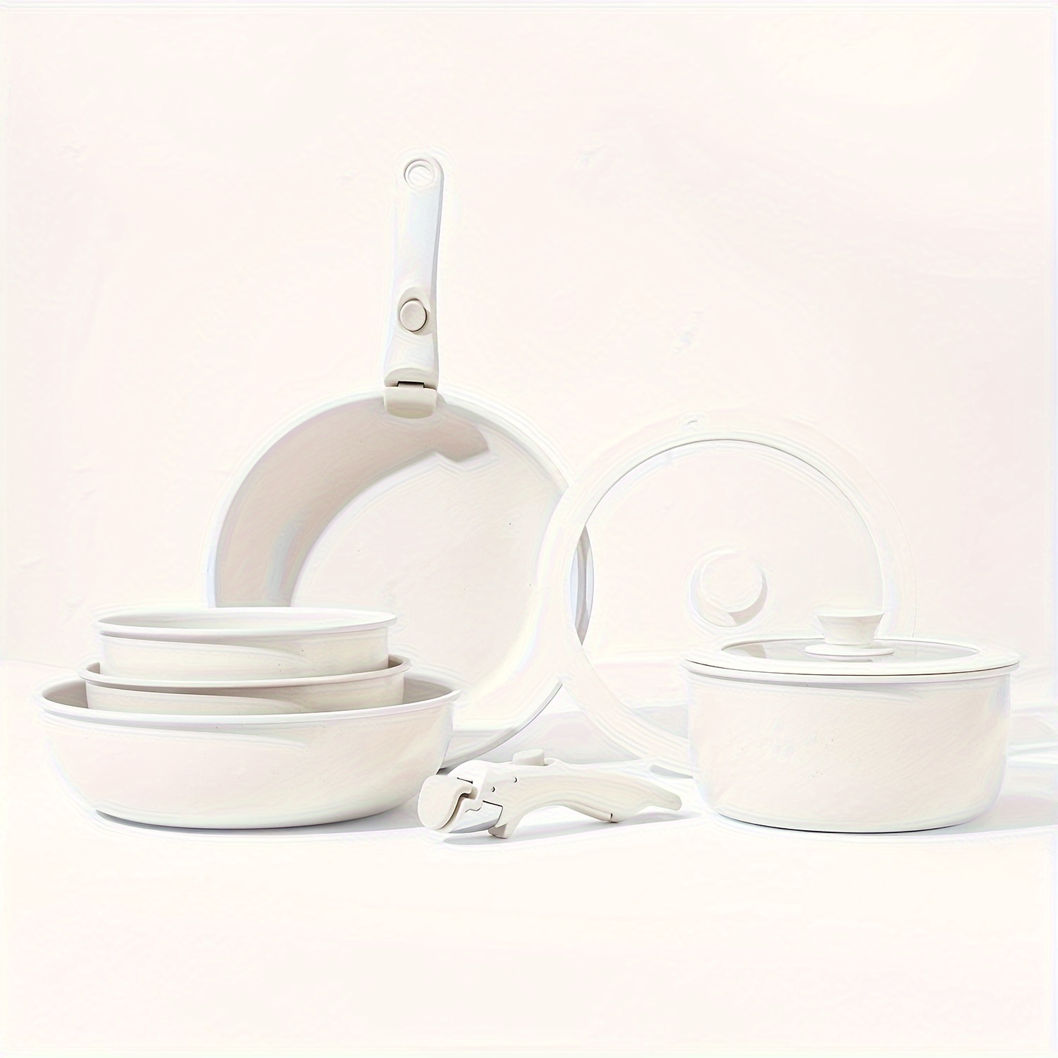 

Complete Set Of Detachable Handle Cookware For Home Use, Including Frying Pan, Soup Pot, And Flat Bottom Pan.