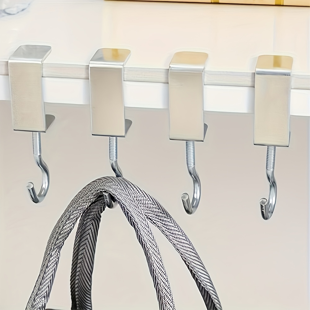 Un gancho plateado ajustable para mochilas, perfecto para muebles y escritorios de dormitorio, diseñado específicamente para colgar bolsos, ganchos utilitarios
