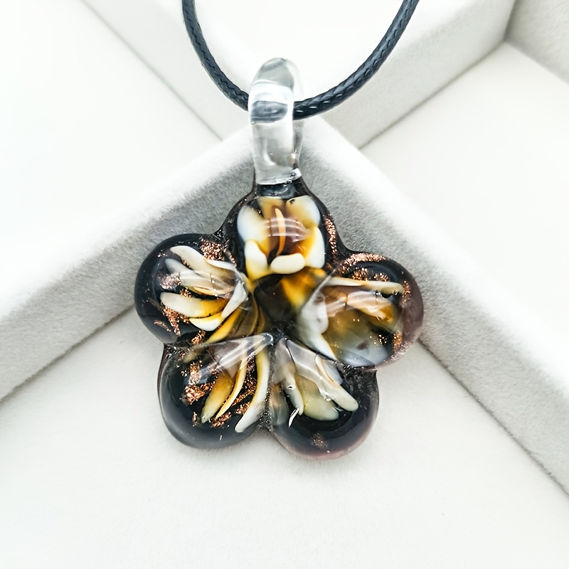 Glass Pendant Necklace on Floral Background for Daily Occasion