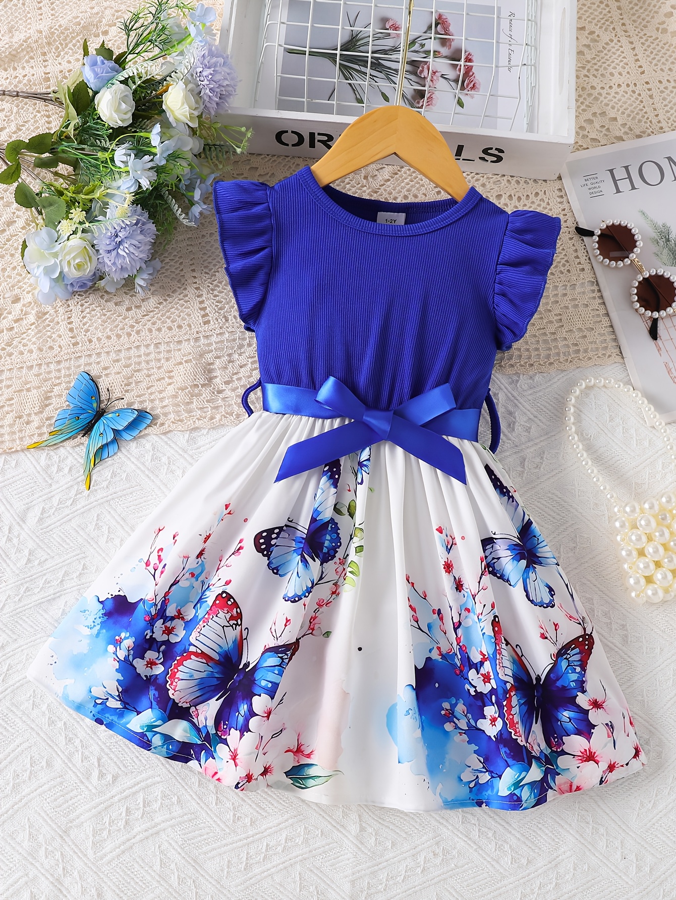 Girls' butterfly print petal European and American splicing pleated hem dress with belt, suitable for casual vacation parties. Perfect for outdoor occasions