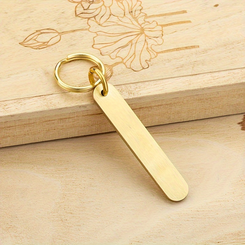 A Personalized Brass Phone Number Tag That Customized With Text, Suitable For Men And Women, Designed As A Easy Keychain Pendant For Car Keys