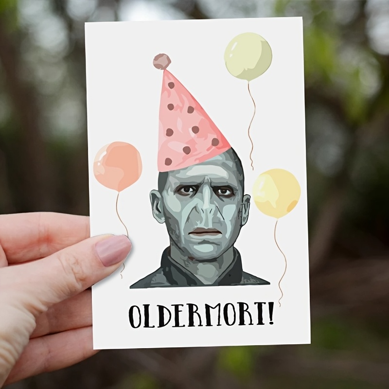 Image of Harry Potter Birthday Card With Funny Voldemort Theme, Featuring Voldemort's Iconic No-nose Look, Cold Tone , Pink Polka Dot Party Hat, Pastel Balloons, "oldermort!" Joke At