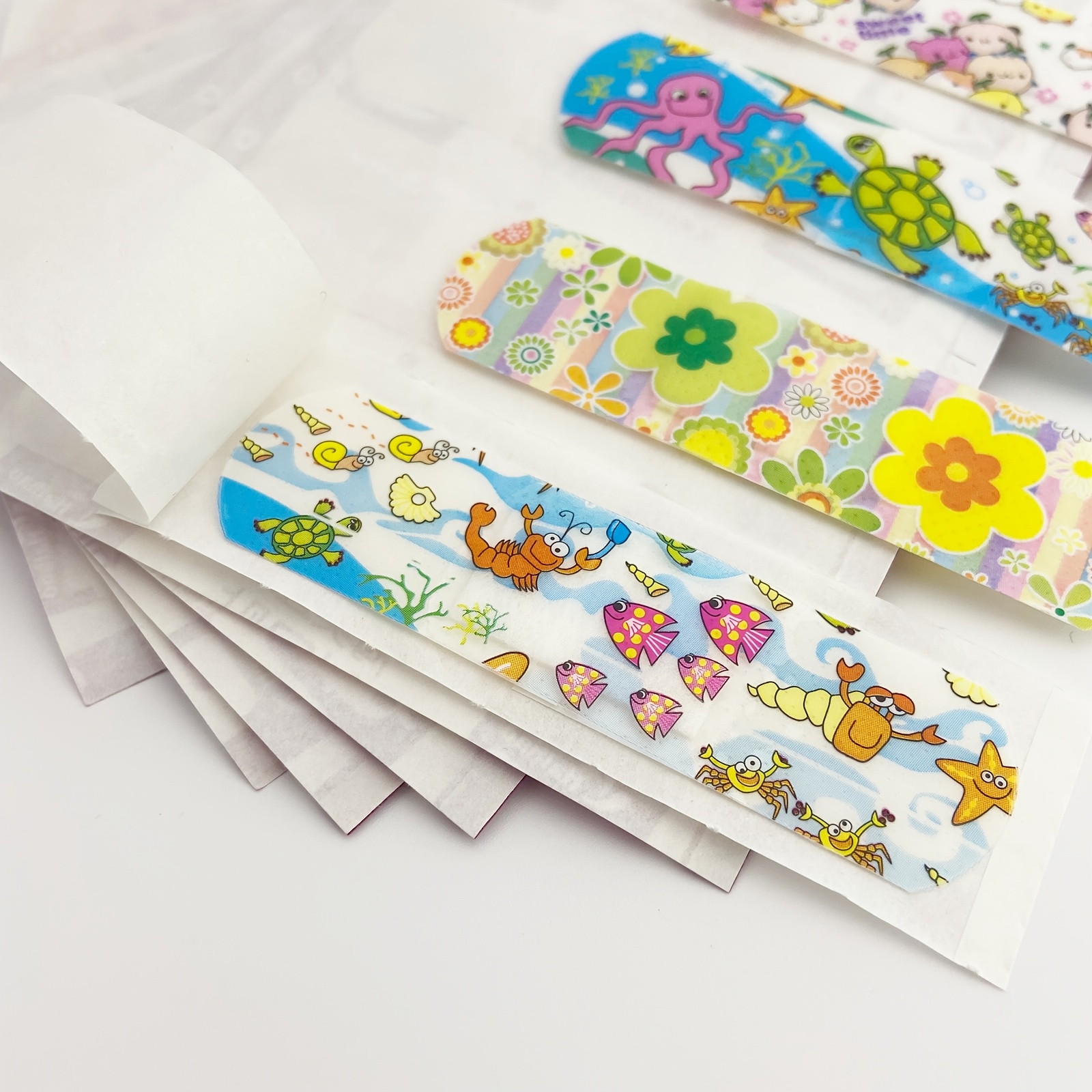 100pcs Cute Cartoon Bandages - Breathable PE Material for Sports & Outdoor Activities