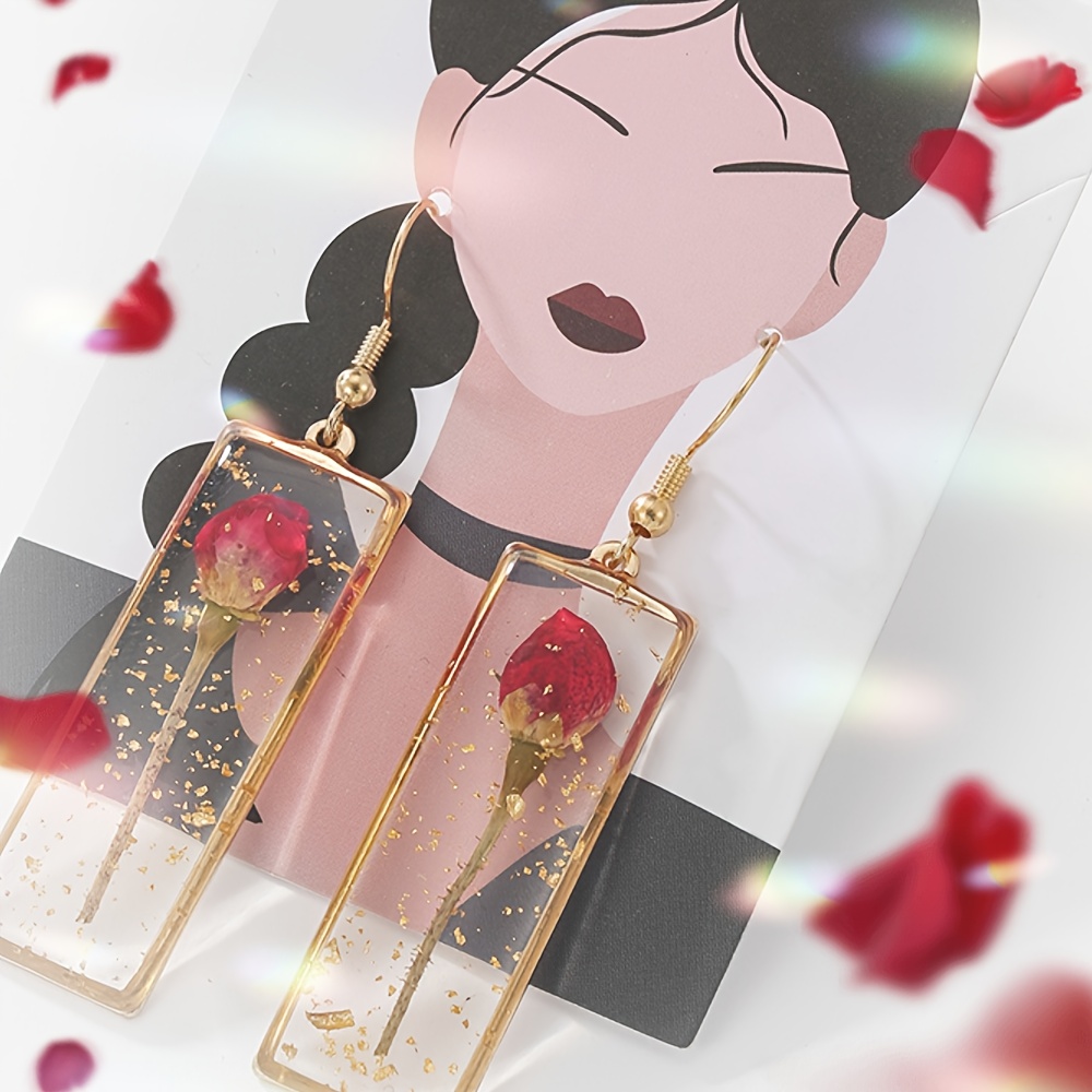 Image of Seal Roses In Transparent Resin To Make Ear Accessories, Keeping Forever. Roses Are Natural Flowers, With Random Shapes And Sizes.