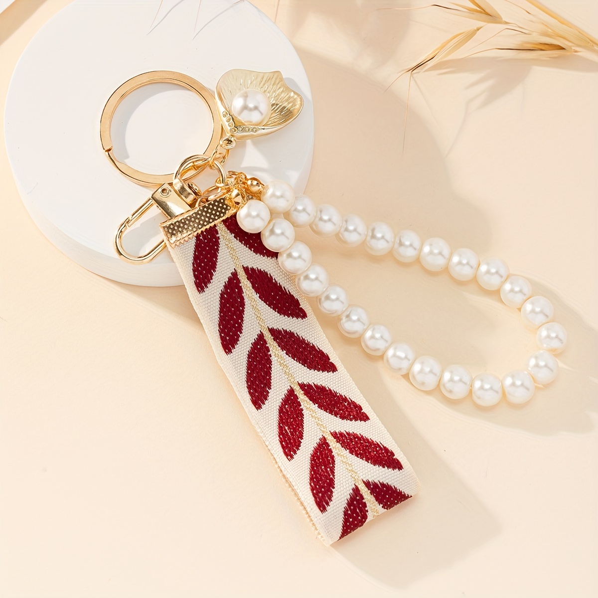 

1pc Woven Ribbon Pouch Charm Creative Fabric Key Ring Accessory For Car Keys And Handbags, Suitable For Daily Christmas, New Year, Valentine's Day Ornaments - Elegant Pearl Alloy Keychain