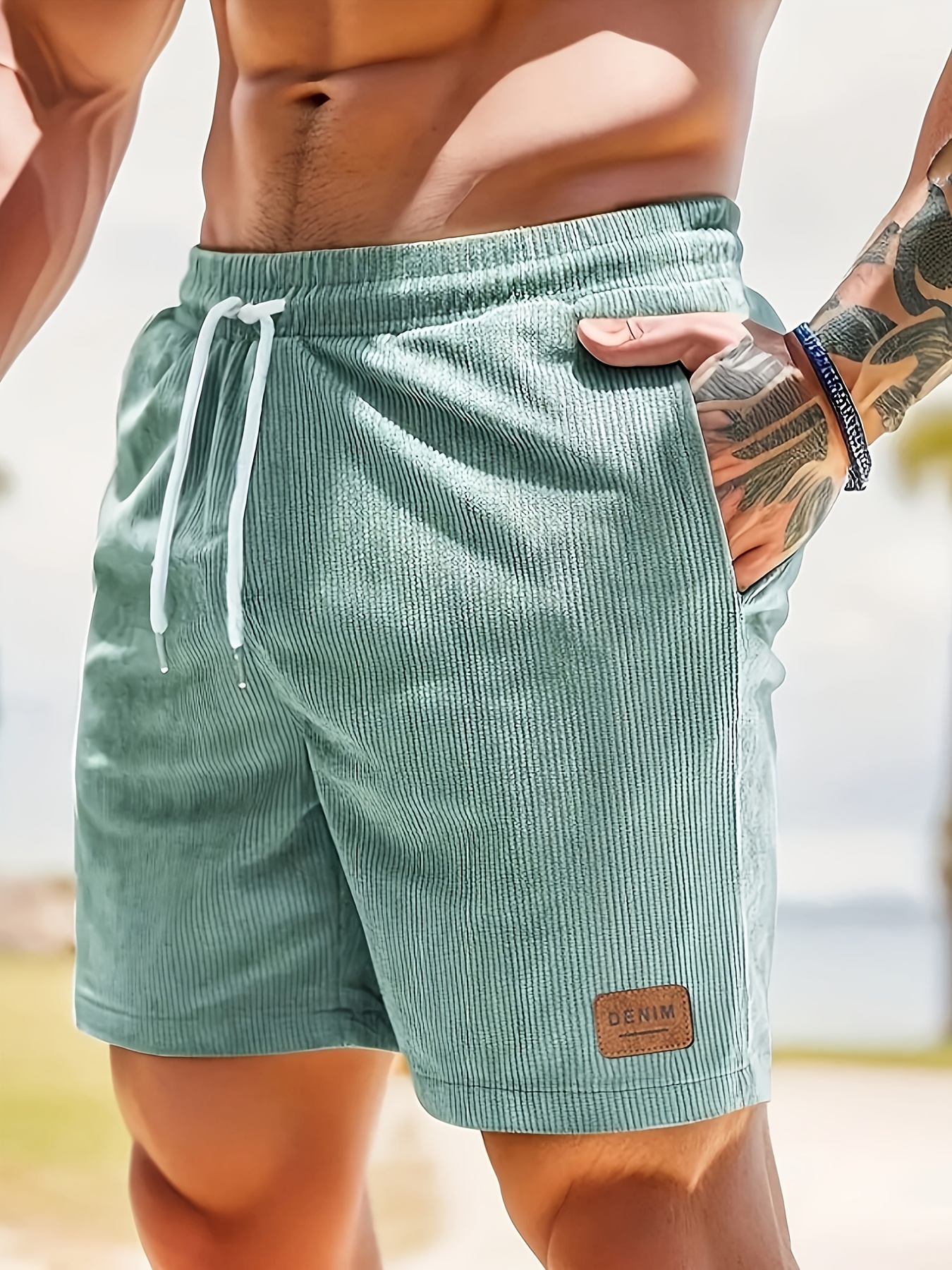 mens solid color corduroy striped pattern shorts with drawstring pocket lettering tag lightweight and comfortable athletic shorts suitable for summer fitness outdoor sports and beach vacations