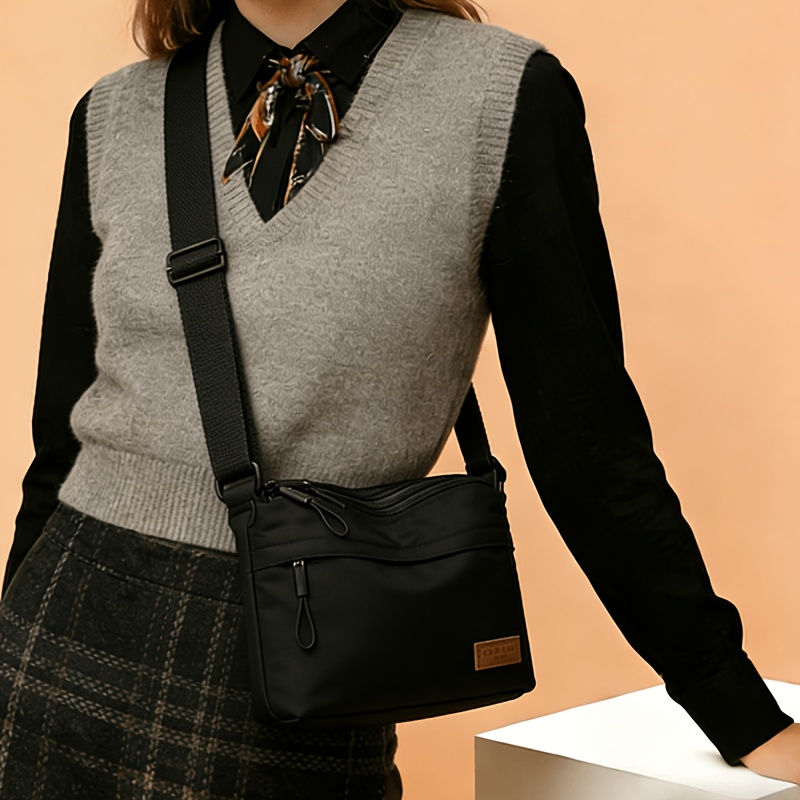 TEMU 's Crossbody Bag Has A Large Capacity, Multiple Layers With Zippers For Closure, An Adjustable Shoulder Strap, Suitable For Casual And Daily Use