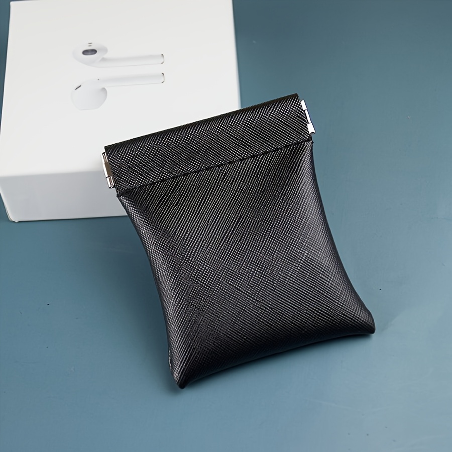 A Mini Wallet Made Of, Suitable For Men And Women, Designed To Hold Headphones, Keys, , And Other Small Items