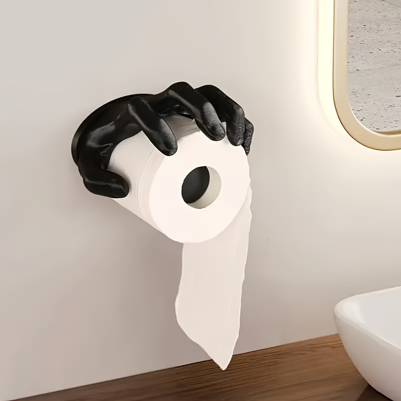 

A Creative Black Hand-shaped Wall-mounted Toilet Paper Holder, Self-adhesive And , Making It A Hygienic Bathroom Accessory.