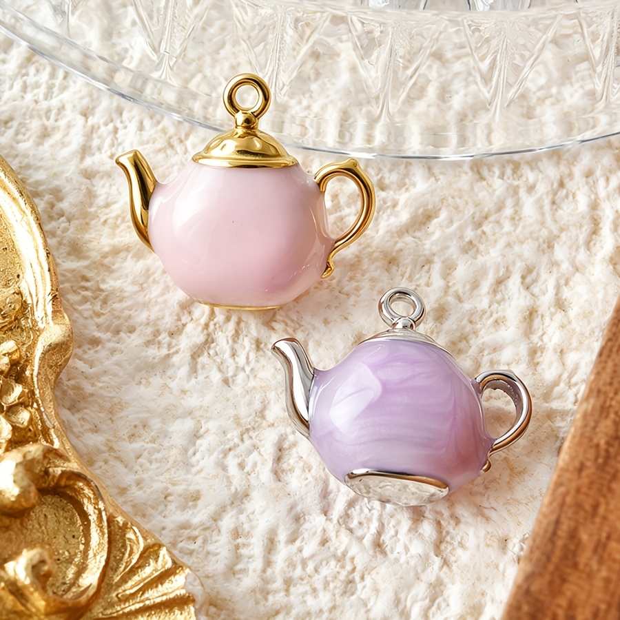 TEMU 2pcs Steel Teapot-shaped Pendants With Oil-drop Finish, Available Color Options: Light Pink And Taro Purple Ombre. Design Features A Full,