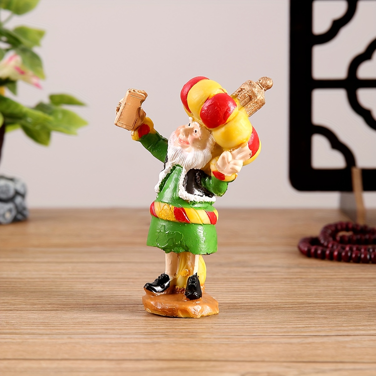 a resin figure of a chubby old man with a cannon suitable for decoration during eid celebrations Product details 6