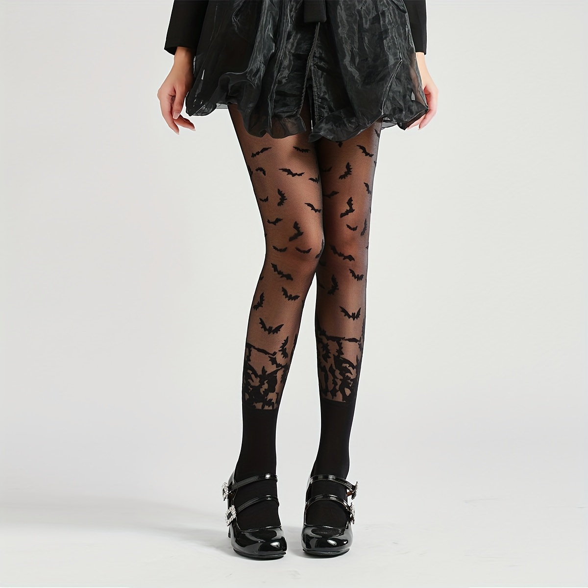 Image of A Pair Of Vintage-style Black Sheer Tights With Bat Patterns For Halloween