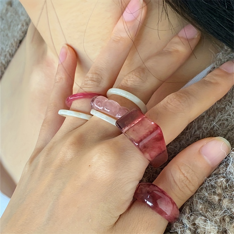 

Unique Handcrafted Resin Rings Set of 7: Acrylic Resin Rings with Irregular Shapes and Handmade Textures. Wear and Vacations. Each Ring is with Color . No Metal or Enamel. Suitable for All .