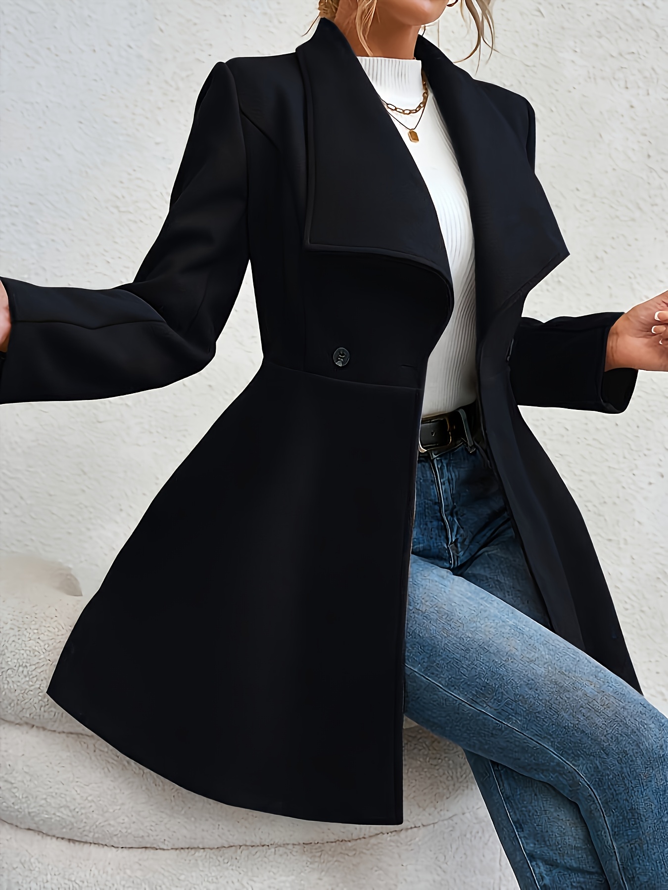 a black long coat for plus size women designed to   fitting and stylish with a lapel showcasing clean tailoring ideal for business commutes important travels