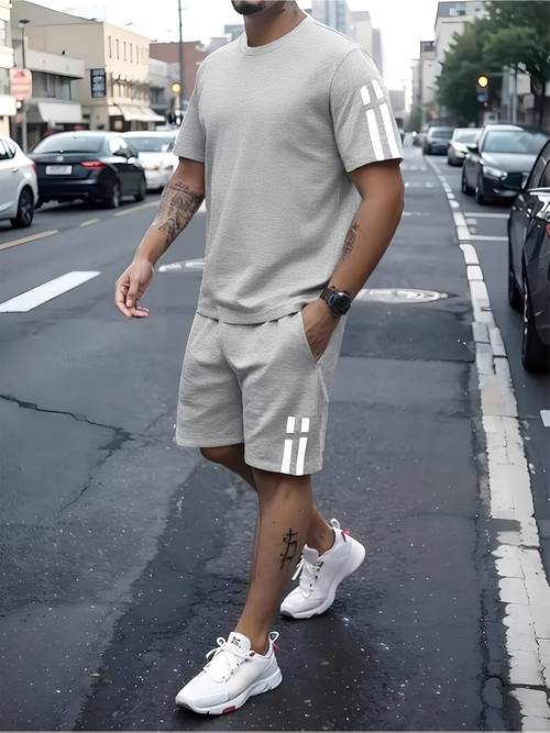 a stylish two piece summer outfit for men featuring a short sleeve round neck t shirt and shorts with pockets