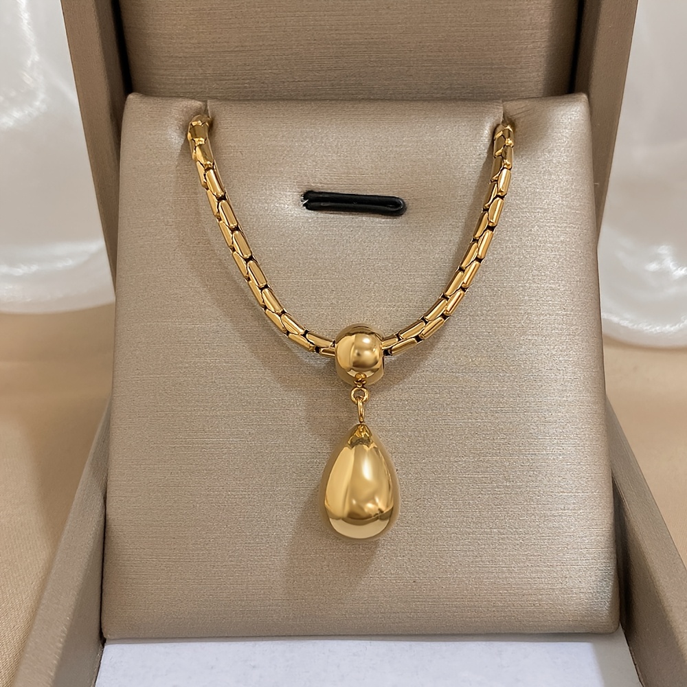 

A Drop Pendant Necklace Stainless Steel, Featuring A Golden Sweater Chain, Perfect As A Party Gift.