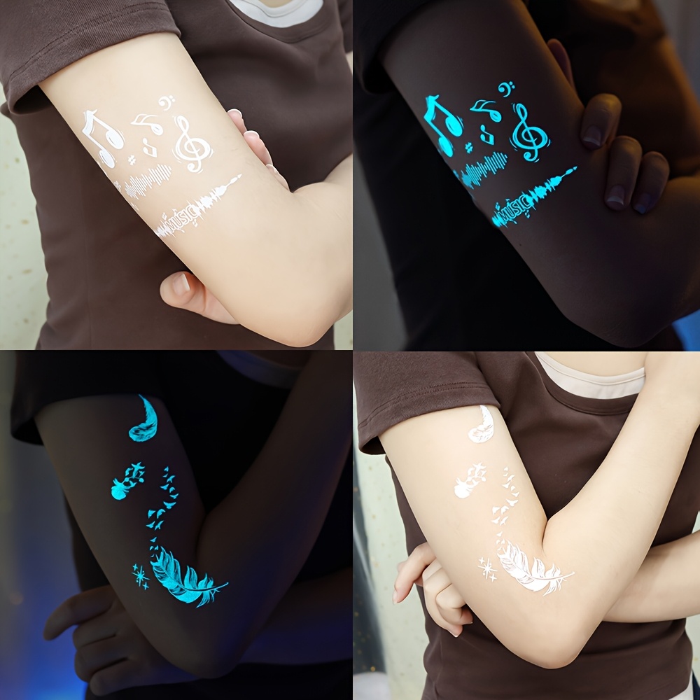 of glowing   stickers for women featuring designs of feathers snakes and butterflies in white     tattoos     to   chest   hands and fingers making them   weddings nightclubs Product details 3