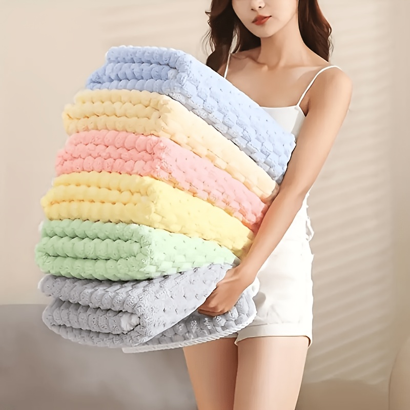 a waffle weave bath towel made of ultra absorbent microfiber quick drying textured towel   and gym towel durable for everyday use making it an ideal christmas gift