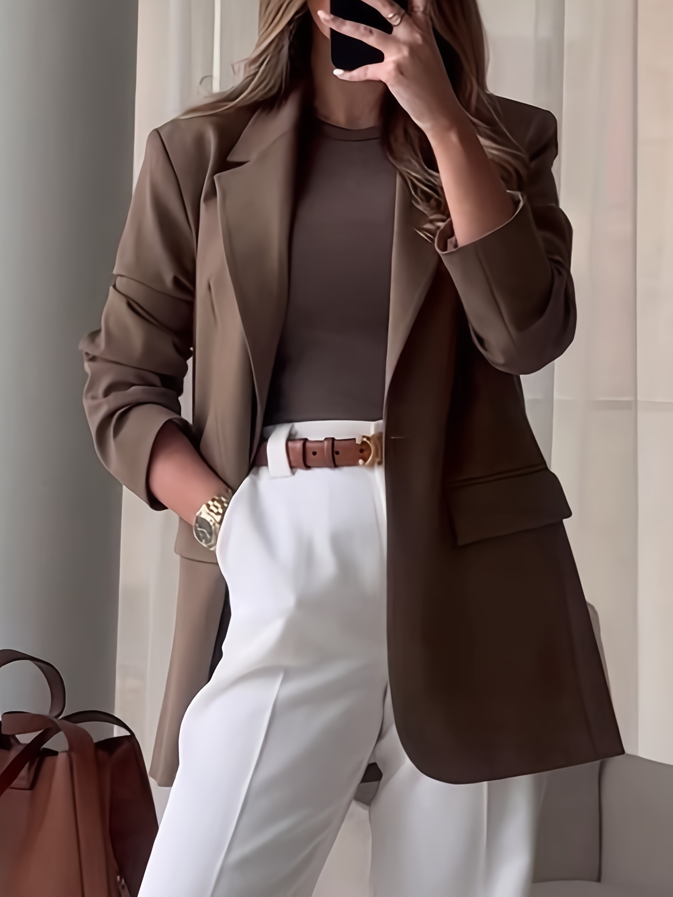 The Everyday Solid Blazer by Newness A versatile elegant blazer in a solid color perfect for the office commuting or casual wear