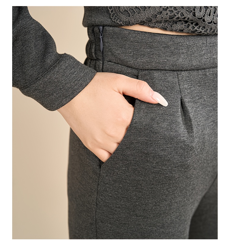 Back view of the complete solid color two-piece pant suit