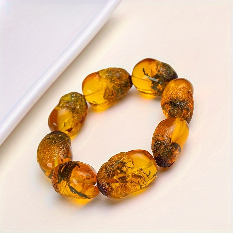 

Due To Light , Is A Color Difference. A Grass Amber Random Shape Bracelet, Large Size Bracelet, Water Grass Is , Natural Material, Diversity, Natural Resin, Amber Beeswax