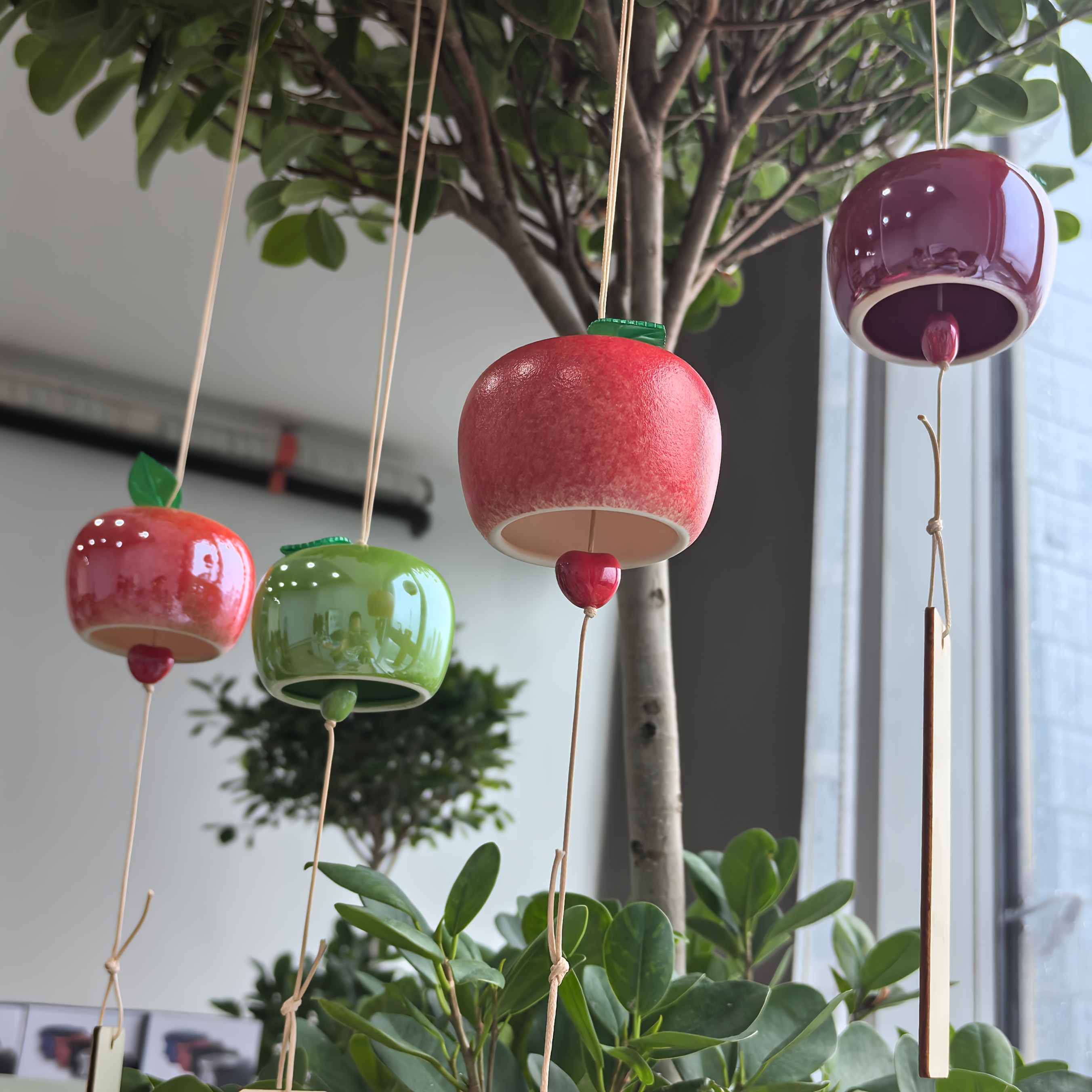 a ceramic wind chime resembling an   measuring 60cm 23 62 inches featuring a wooden message board this small artistic wind chime is suitable for bedrooms gardens patios