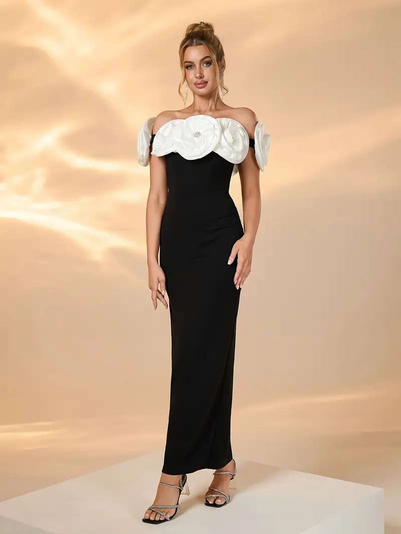 black and white floral bridesmaid dresses A bride in a white gown, styled by Victoria Barrett, holds a bouquet and poses with five bridesmaids in black dresses, each holding white flowers. A young flower girl in a white