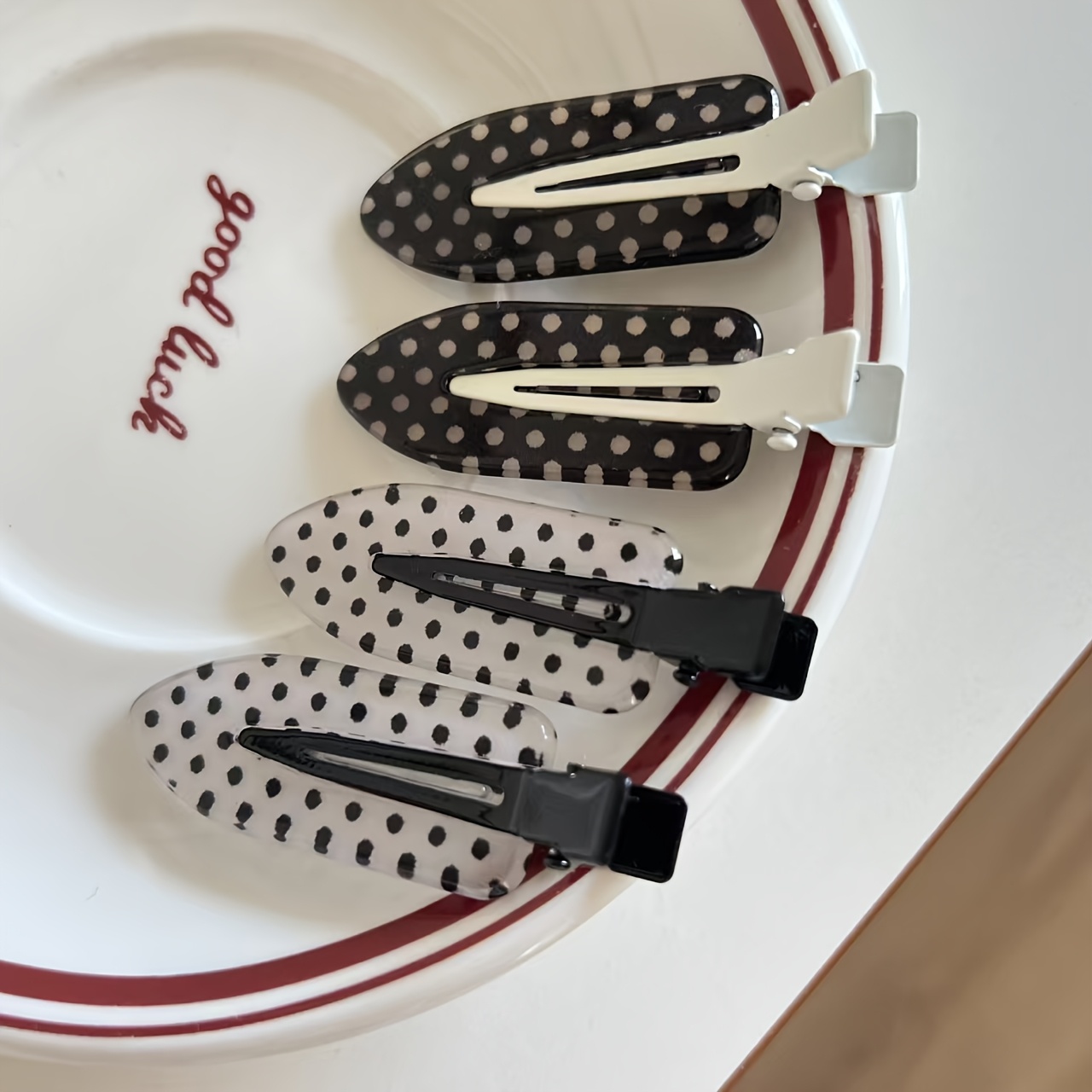 4 white and black polka dot hair clips suitable for womens   wear