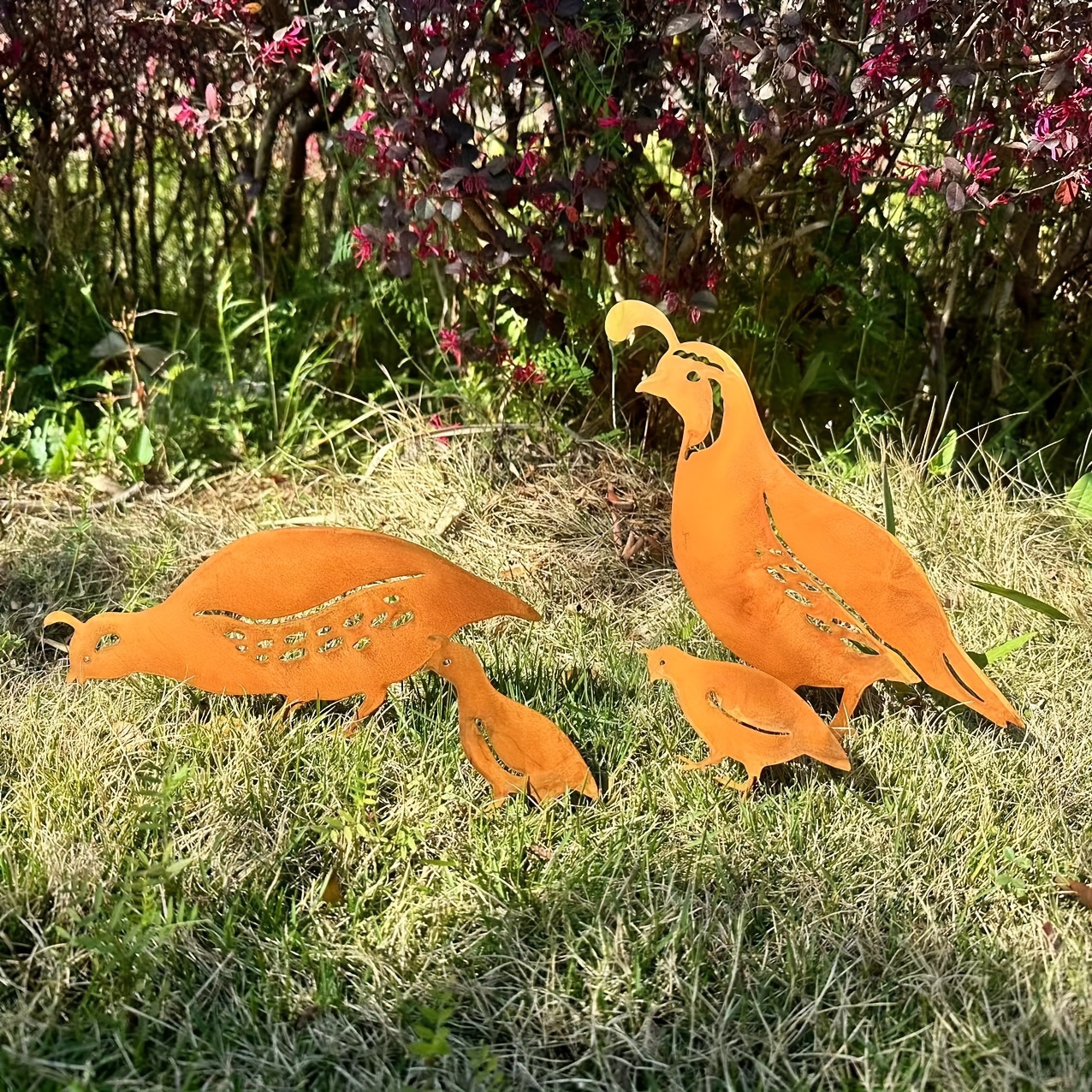 

A Unique Rusty Outdoor Iron Craft Of A Quail Family For Courtyard Decoration In Spring Garden Landscape.