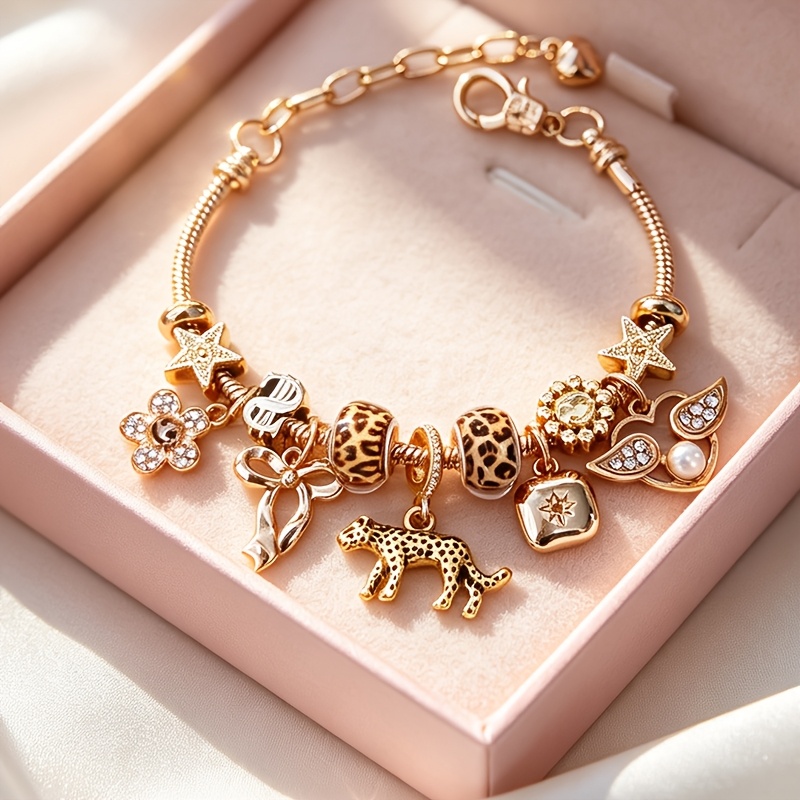 TEMU Pulsera de dijes ajustable para mujer con estampado de leopardo, cadena de serpiente en tono dorado con colgantes de leopardo, estrella y ,