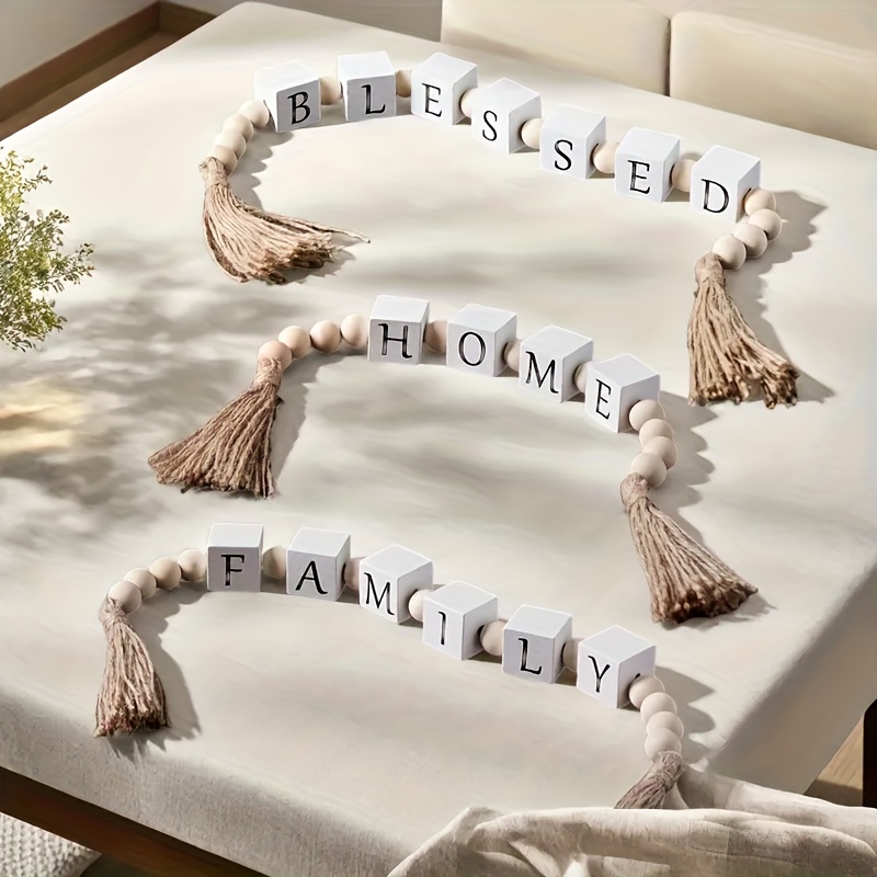     with   adorable wooden letter garlands featuring   love blessed each combines wooden cubes beads and tassels for a cozy rustic feel   shelves