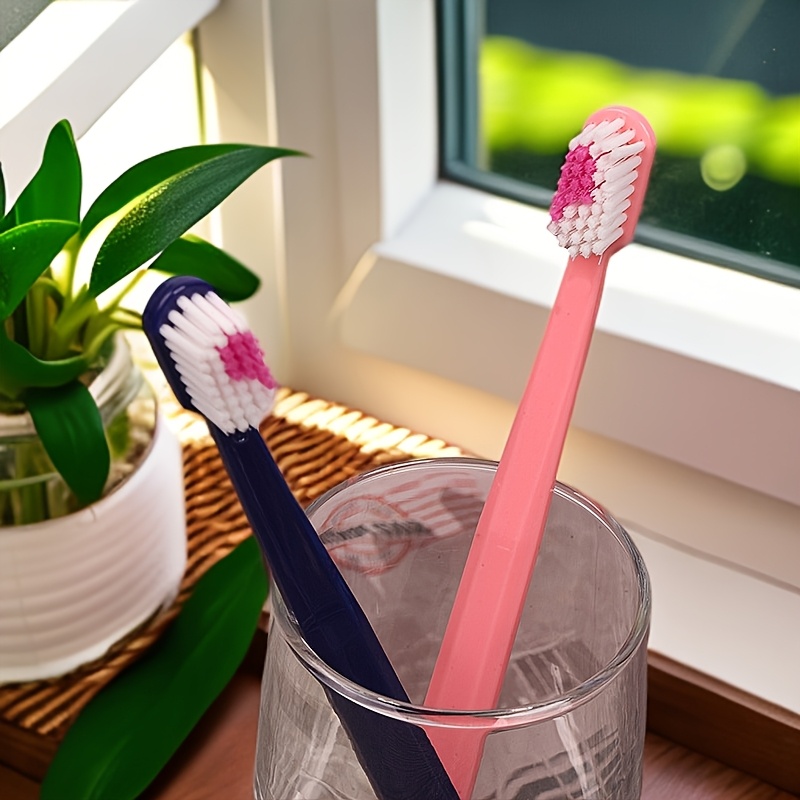 Image of A Set Of 2 Soft-bristled Manual Toothbrushes Designed For Couples, Featuring A Creative Heart-shaped Bristle Design In And Rose Red, Perfect For Wedding Gifts And Convenient For
