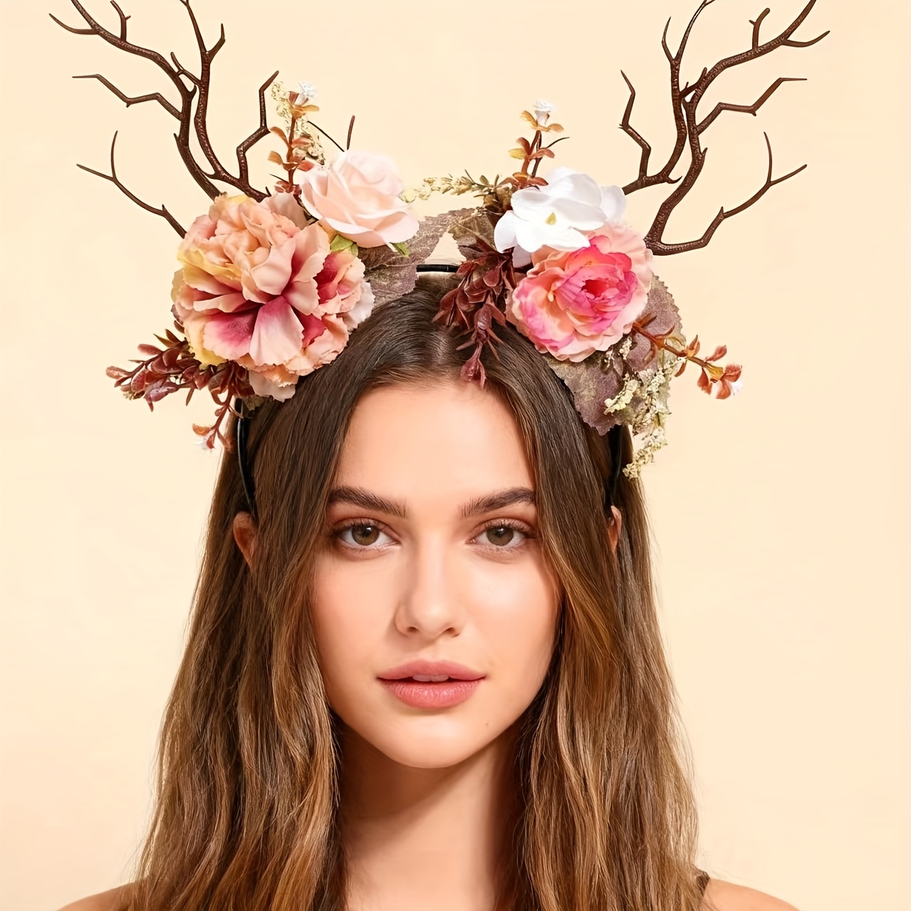 Image of A Delicate Forest-themed Headband With Antlers And Light Pink Flowers, Designed As A Decorative Prop For Photography And A Hair Accessory For