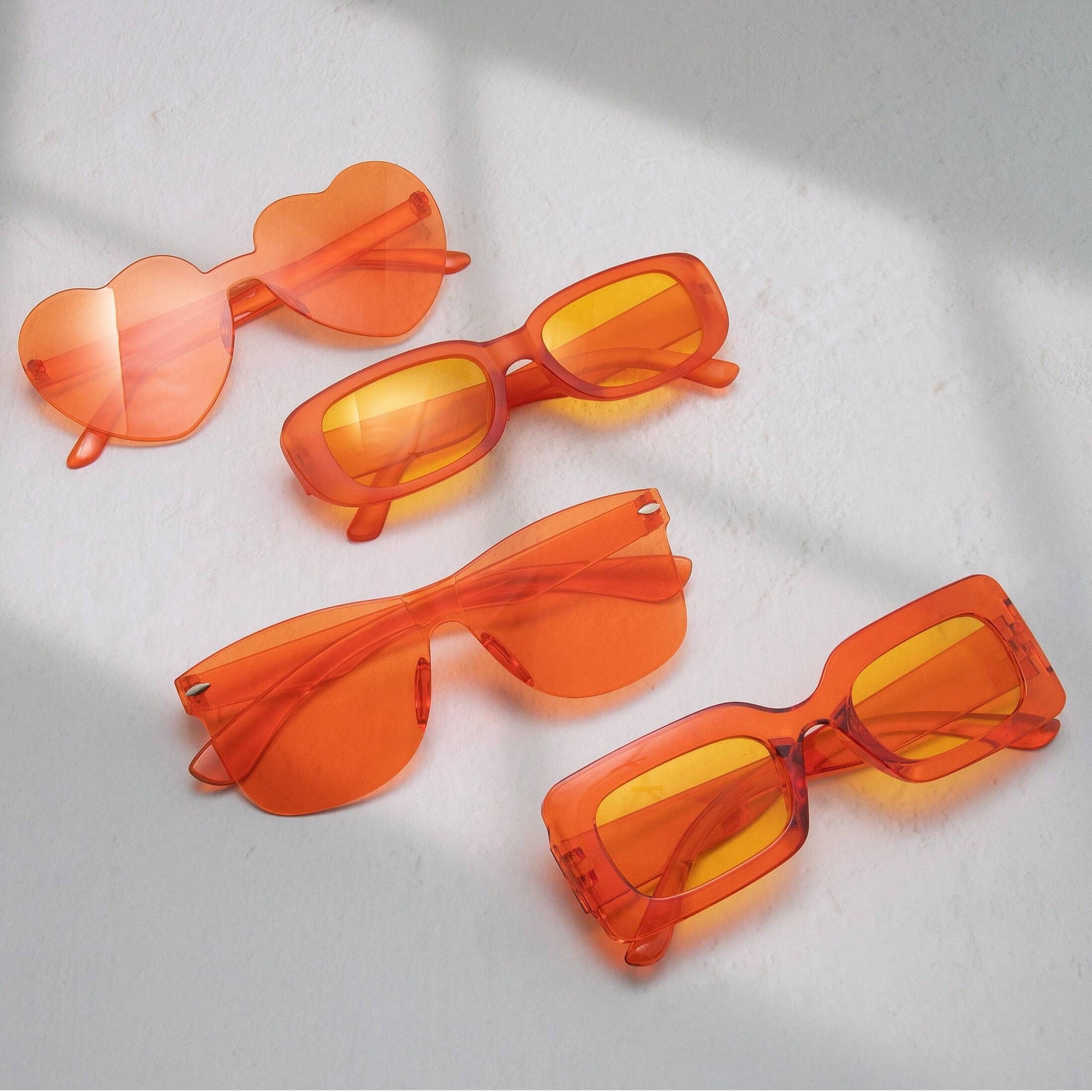 

4pcs Orange Fashion Glasses Frameless Style Party Favors Suitable For Outdoor Activities