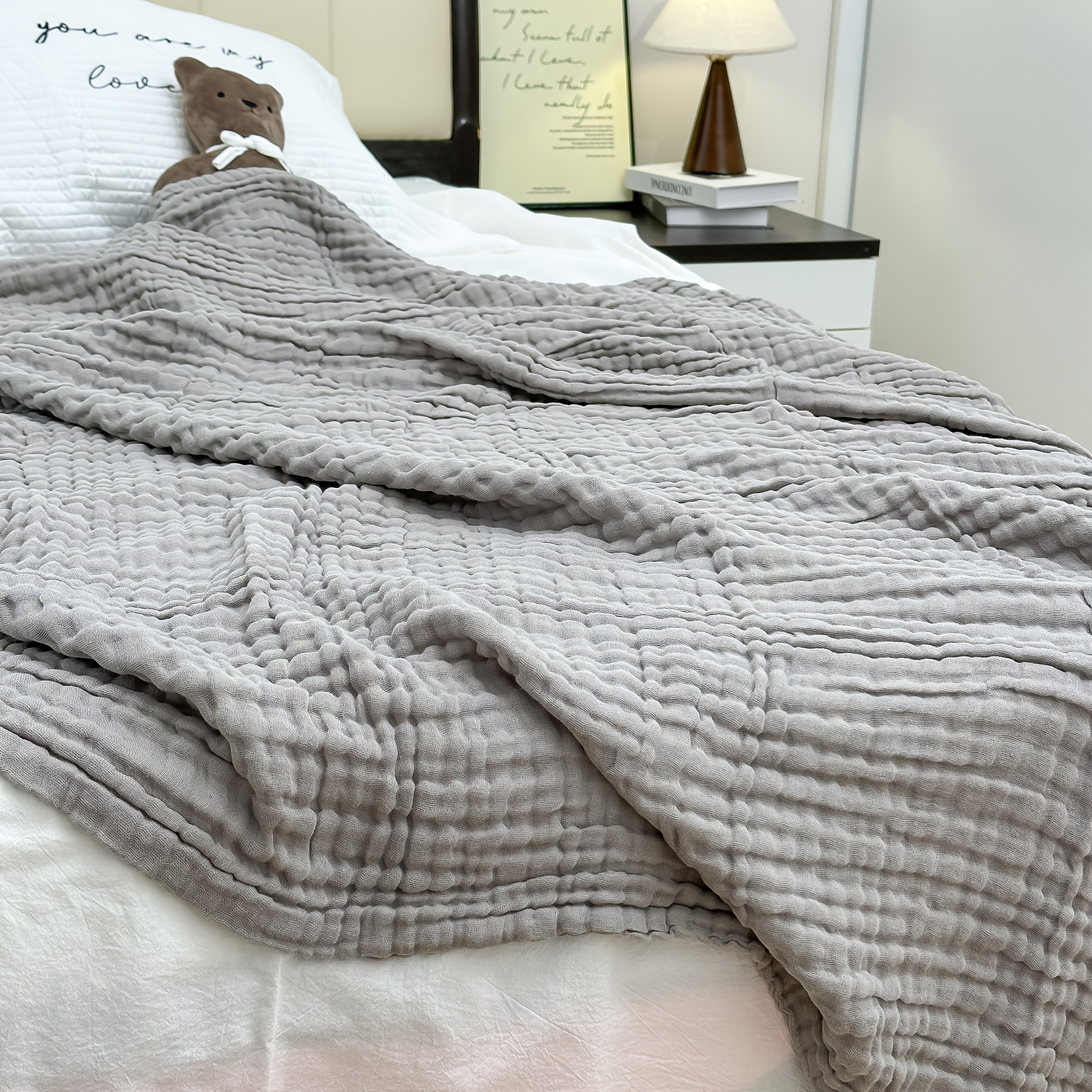 Image of A 6-layer Gauze Cotton Blanket, Made Of 100% Cotton, Measuring 200*150cm. The Fabric Is Soft, Skin-friendly, And Gentle Without Irritation. In Colors, Used On A Sofa Or For A Nap On The Bed