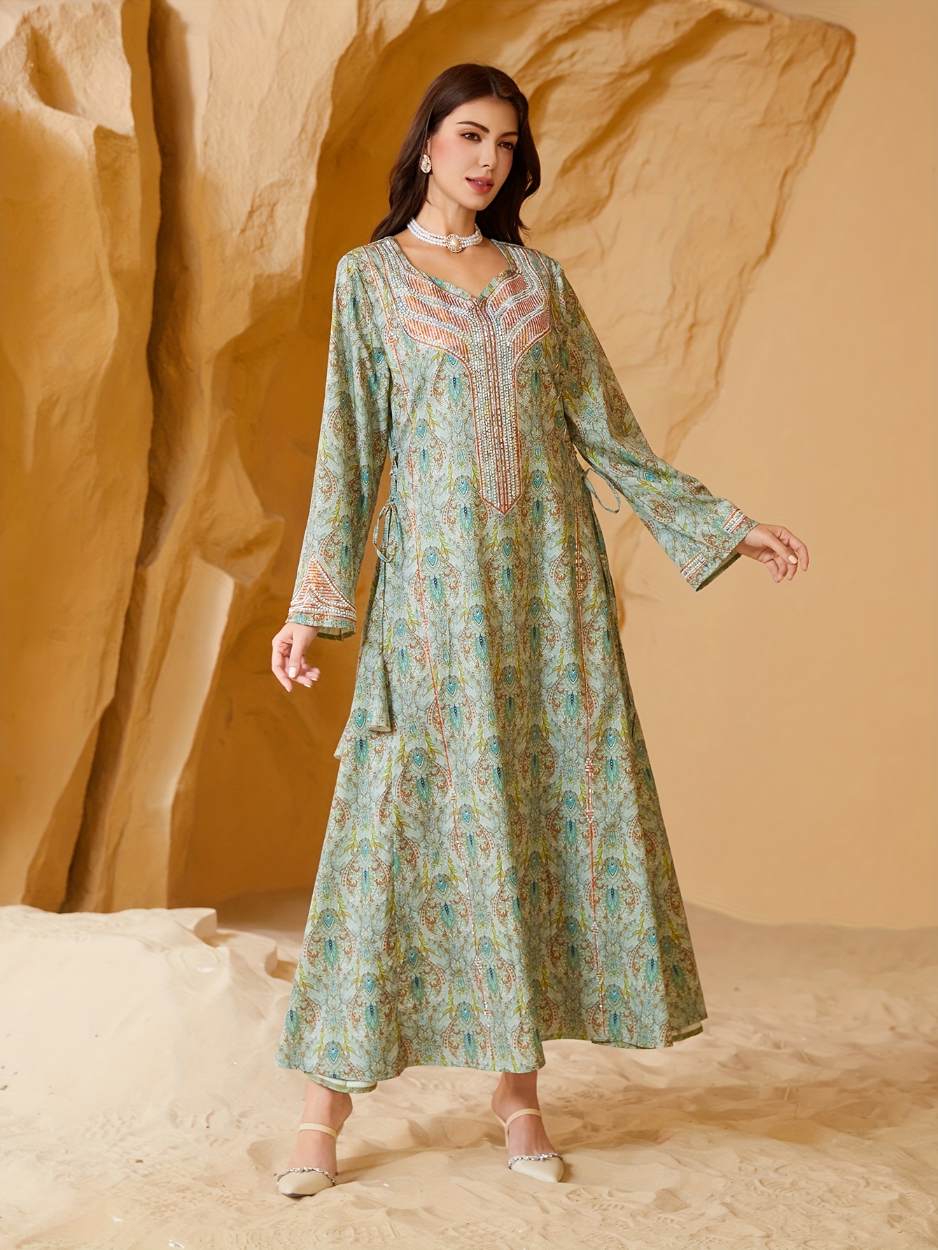 A Women'S Muslim Dress Featuring a Printed Design with Sparkling *  Embellishments, an Elegant Islamic Abaya