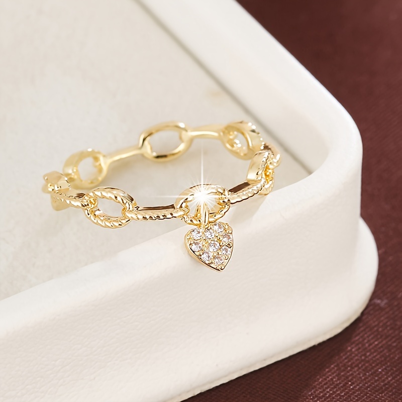 A Women's Ring With A Chain And Heart-shaped Pendant, Set With Synthetic Synthetic Zirconia