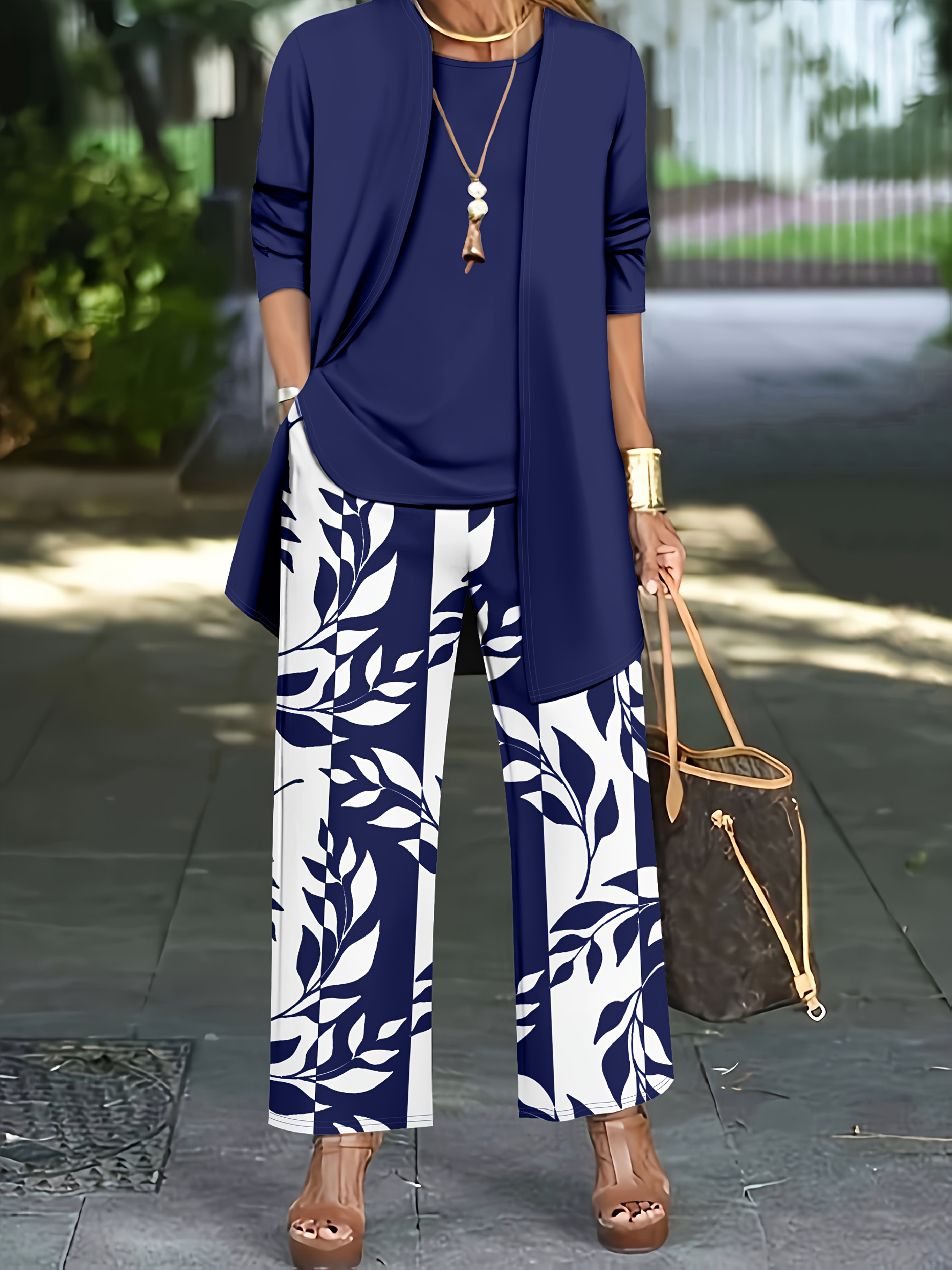Model wearing Newness elegant Botanical Print Pants Suit showcasing its high elasticity and flattering fit
