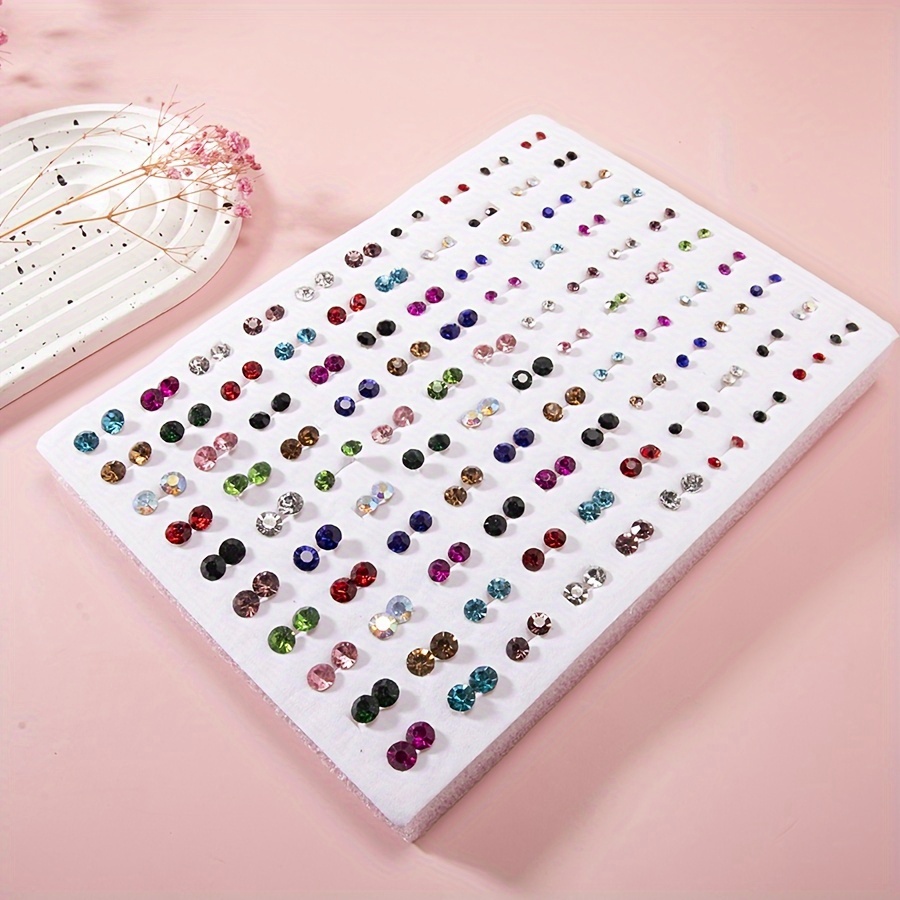 

Ensemble Chic de 100 Boucles d'Oreilles Clous en Strass pour Femmes - Diamants Faux Ronds Colorés en 3 Tailles (3mm/5mm/6mm), Tiges en Plastique Tendance, Parfait pour le Quotidien & les Fêtes