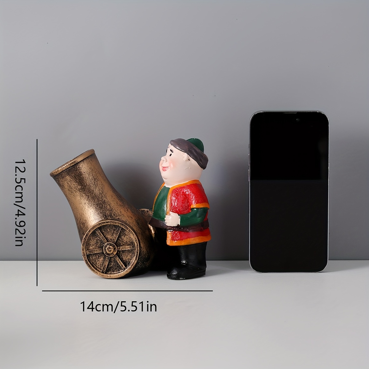 a resin figure of a chubby old man with a cannon suitable for decoration during eid celebrations Product details 3