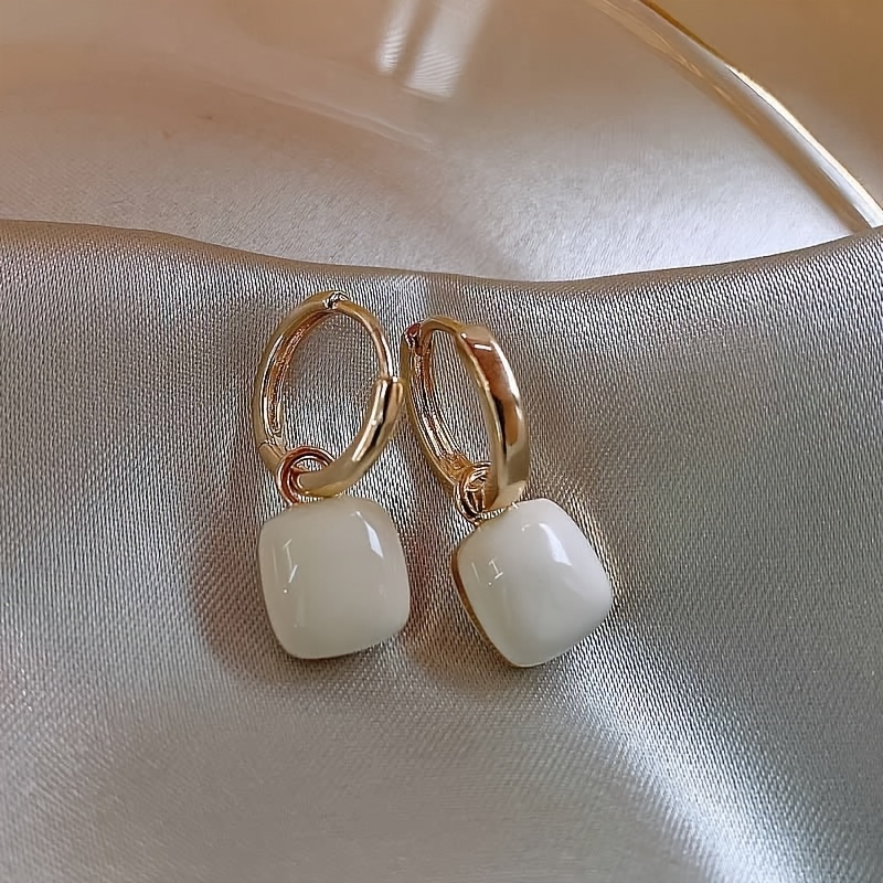 A Pair Of Stylish And Elegant White Drip Earrings, Copper Products, Suitable For Daily Wear Or Parties, For Ladies