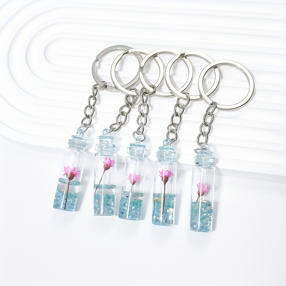 item picture 5pcs of luminous keychains featuring unique floral designs resin additions for decoration and backpack charms